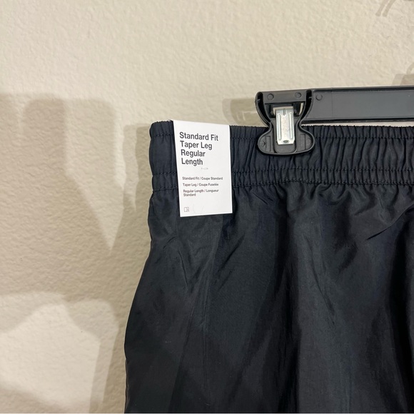 NWT Men’s Nike woven nylon tapered track pants standard fit sz XXL black active - Picture 12 of 14